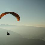 pexels-photo-382177-382177 Experience the thrill of paragliding over the stunning Lake Annecy with breathtaking mountain views.